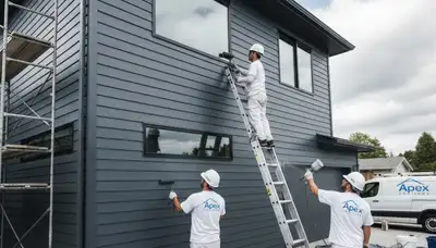 Professional siding painters in Fort Collins CO applying durable exterior paint for local homes