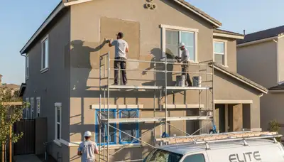 Expert stucco repair and painting on Fort Collins, CO home exterior by local professional painters